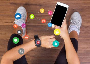 How can wearable devices be used to promote and track both physical and financial health?